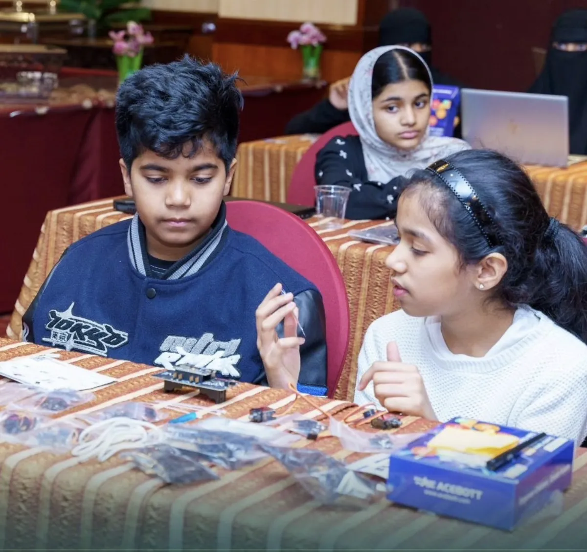 Students assembling robotics kits at a Steyp workshop in Al Nahda, Dubai
