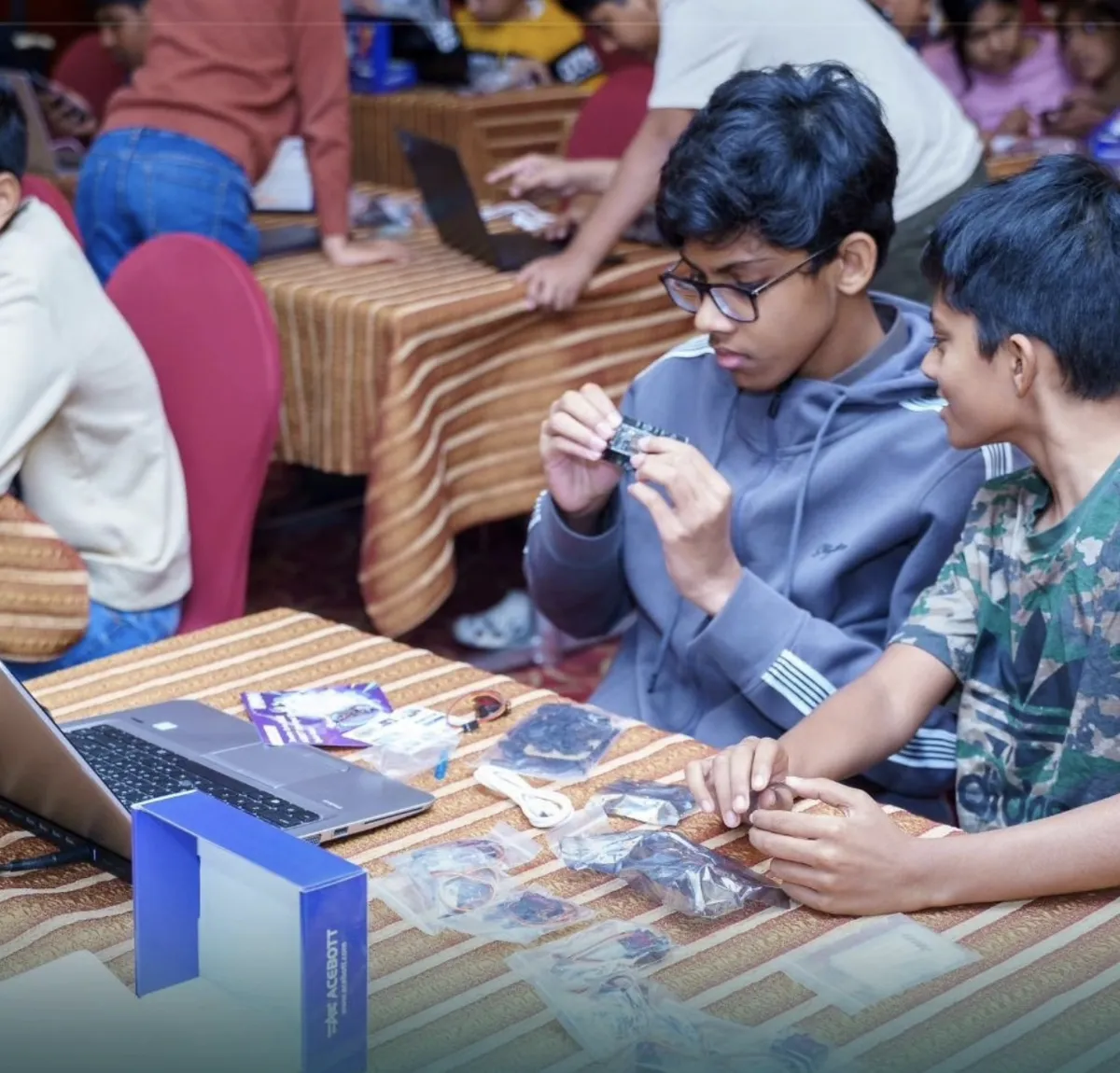 Students assembling robotics kits at a Steyp workshop in Al Nahda, Dubai
